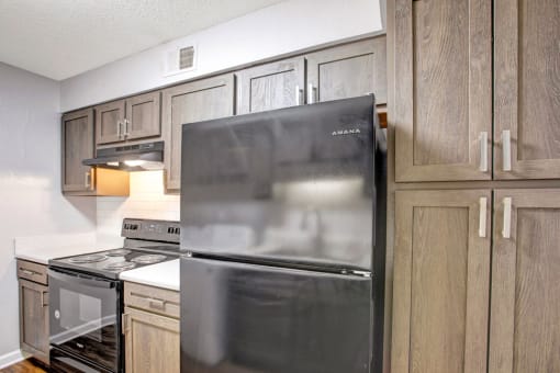 Upgraded Kitchen, black whirlpool appliances, laminate countertops