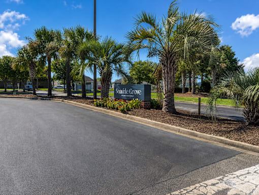 Landscaped entrance to Seaside Grove Apartments in Carolina Forest, Myrtle Beach, SC
