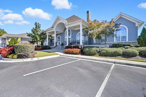A large house with a driveway in front of it.