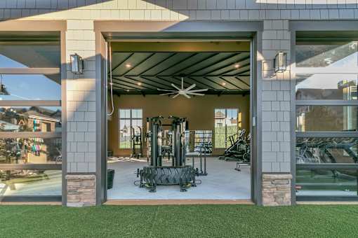 A modern house with a garage and a gym inside.