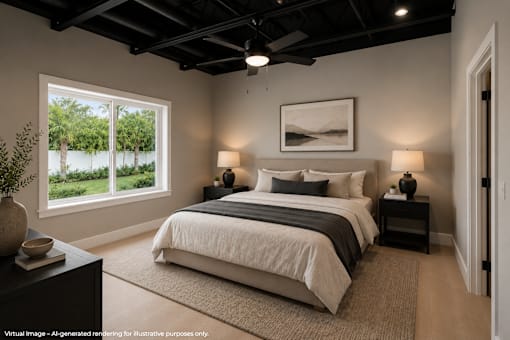 A bedroom with a large bed and a ceiling fan.