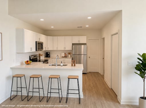 A kitchen with white cabinets and a white island with three bar stools.