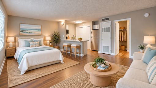 View of a virtually staged studio with coastal furnishings at Waterchase Apartments in Largo, FL.