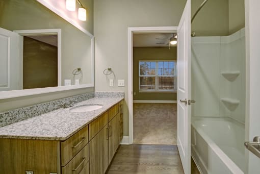Bathroom with tub, sink, and toilet at York Woods at Lake Murray Apartment Homes, Columbia, SC, 29212