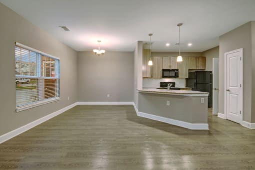 Spacious living room with an open concept to the kitchen at York Woods at Lake Murray Apartment Homes, South Carolina, 29212