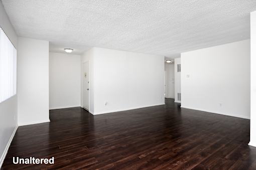 A room with wooden floors and white walls.