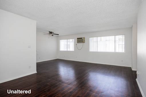 A room with wooden floors and white walls.