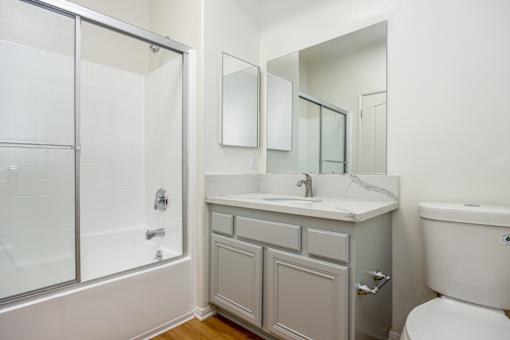 a bathroom with a sink toilet and a shower
