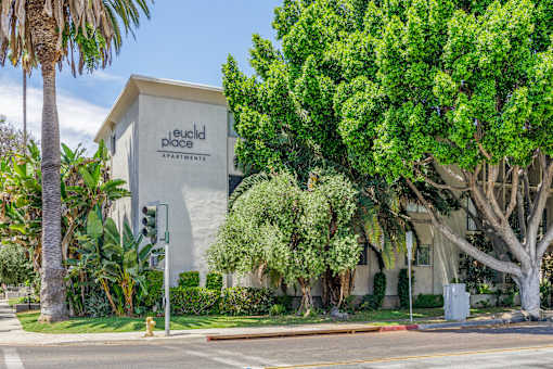 a building with a sign that says red dog apartments