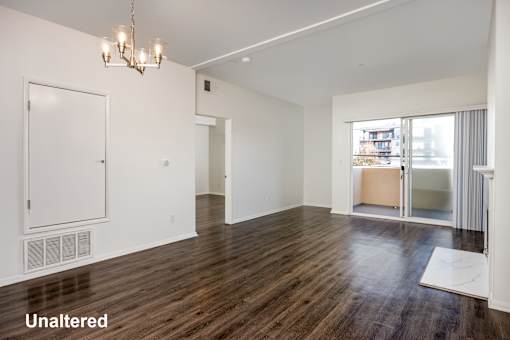 A room with wooden floors and white walls.