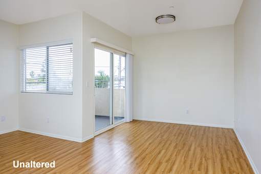 A room with wooden floors and white walls.