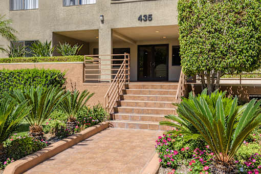 the stairs up to the entrance of an apartment building