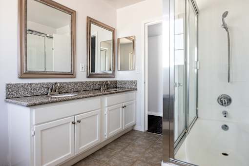 a bathroom with a sink and a shower