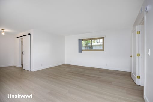 A room with unaltered flooring and a window.