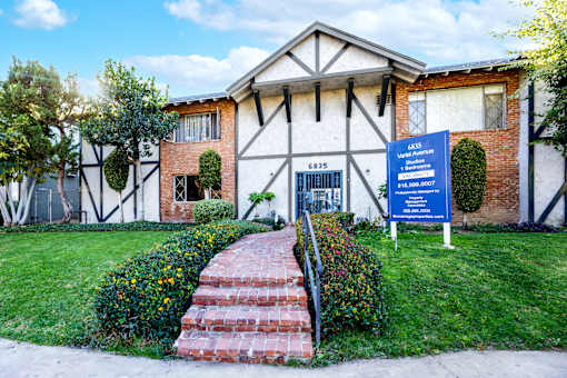 a building with a blue sign in front of it