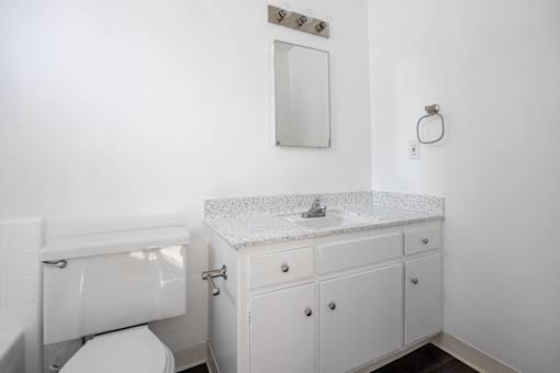 an empty bathroom with a sink and a toilet
