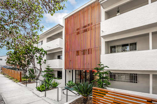 A modern building with a white and orange facade.
