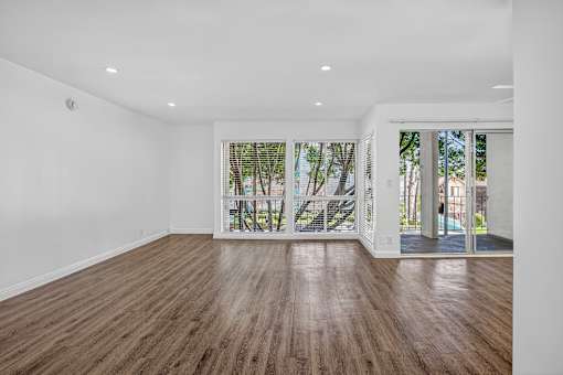 A room with wooden floors and white walls.