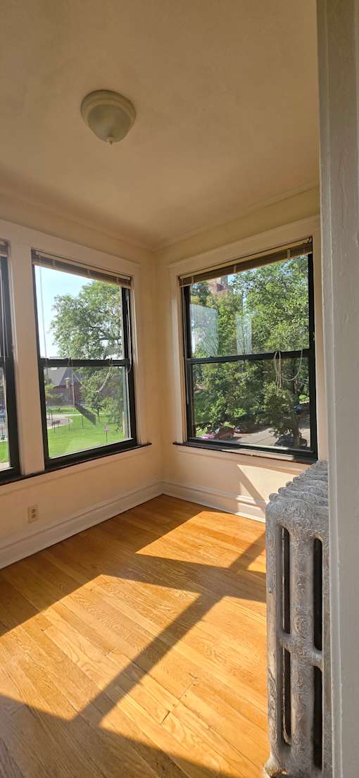 A view from the top of a stairwell looking down at a window.
