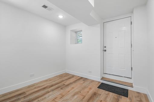A white door is on the right side of the image.