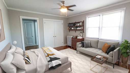 A living room with a grey couch and a coffee table.