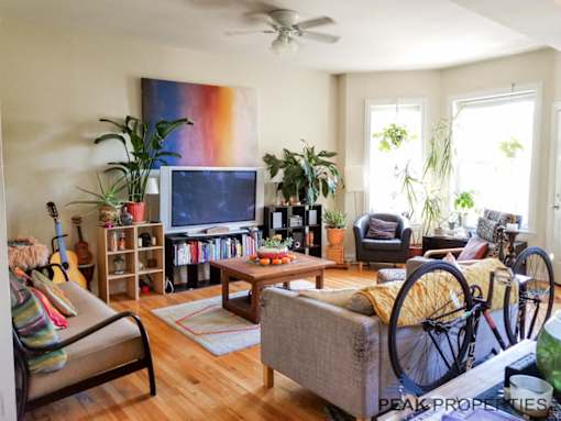 a living room with a bike in front of the tv