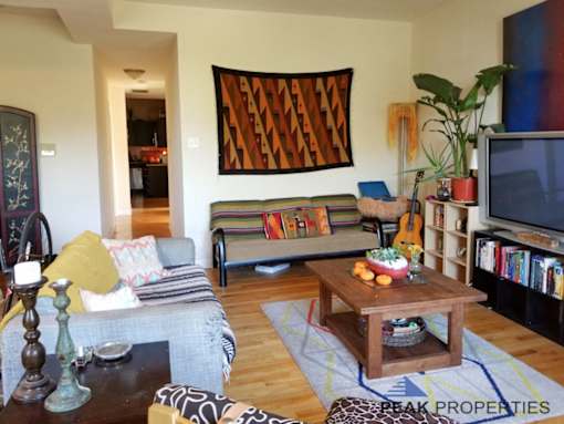 a living room filled with furniture and a tv