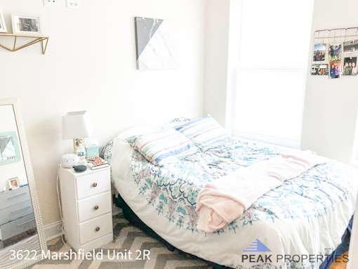 a small bedroom with a bed and a dresser