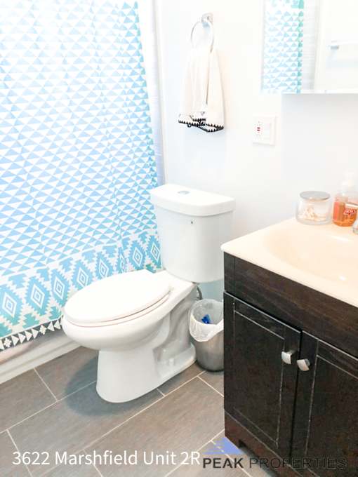 a bathroom with a toilet and a sink
