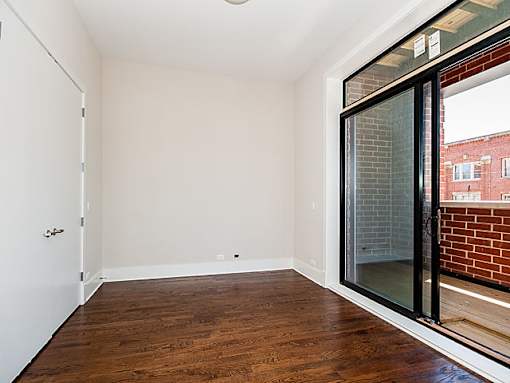 Empty room with a door and a window.