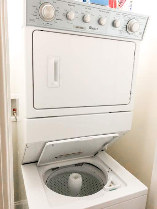 a white washer and dryer in a white room