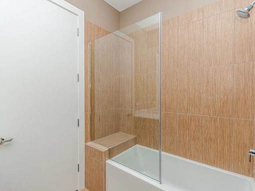 A small bathroom with a walk-in shower.