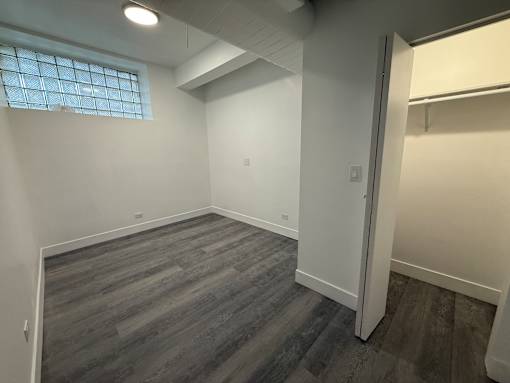 A room with a window and a door.