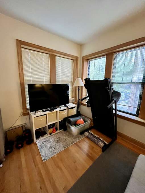a living room with a tv and a couch in it