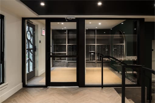 a large glass door leading to a wine room in a building