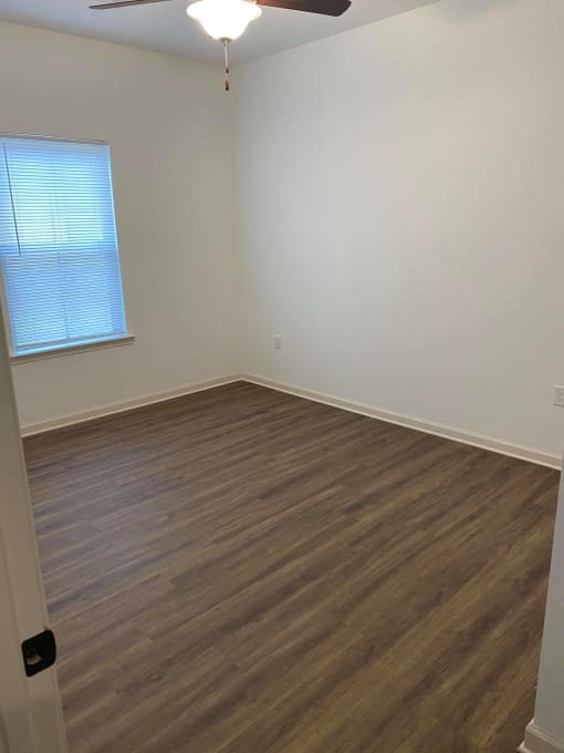 a view from the top of a staircase with wood flooring
