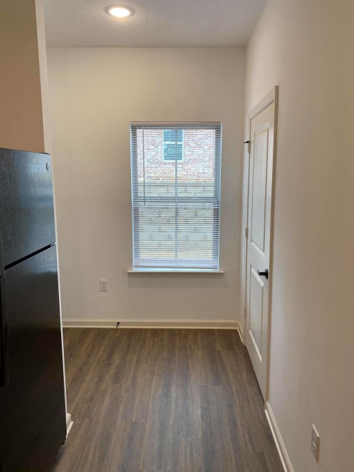 a living room with a window and a door