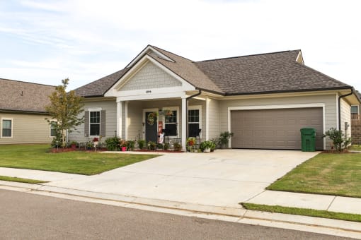 a house with a driveway and a garage door