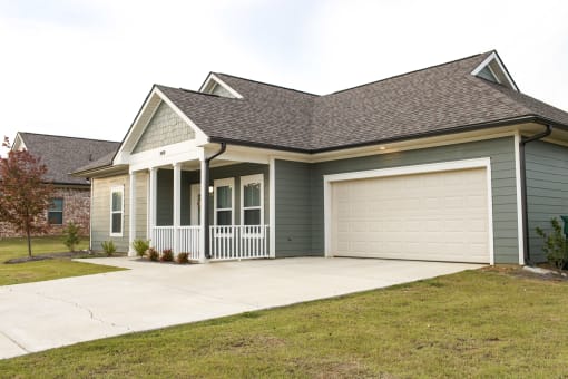 a house with a driveway and a garage door