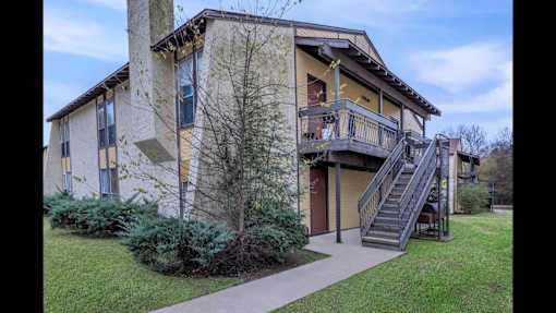 A building with a staircase leading to the second floor.