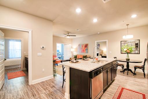 A kitchen with a large island and a dining table at Silver Oaks Apartments, Gonzales, 70737