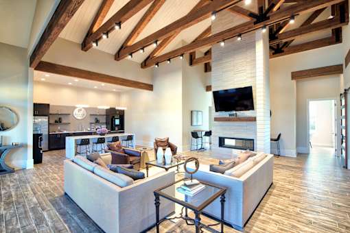 A modern living room with a fireplace and a television at Silver Oaks Apartments, Louisiana 70737