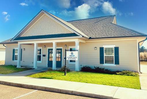 A small building with a sign that says Community Center.