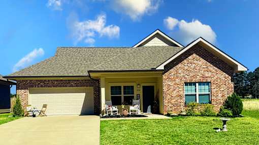 A house with a garage and a driveway.