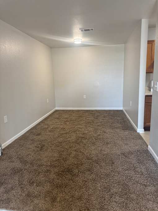 A room with a white wall and a brown wall.