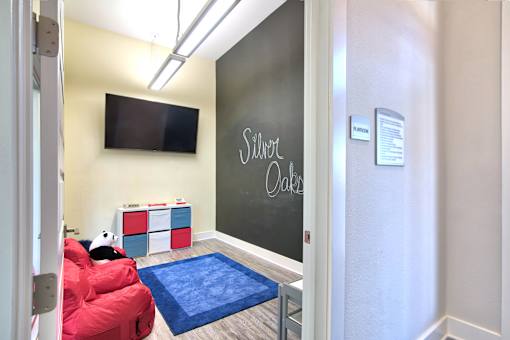 A room with a chalkboard at Silver Oaks Apartments, Gonzales