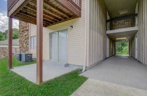 A house with a covered walkway leading to the front door.
