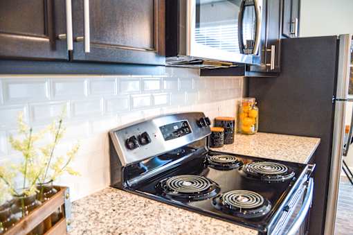 A black stove top oven at Silver Oaks Apartments, Gonzales