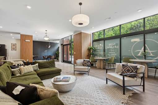 A living room with a green couch and a coffee table.