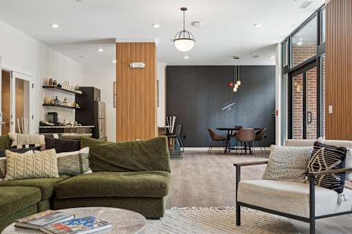 A living room with a green couch and a coffee table.